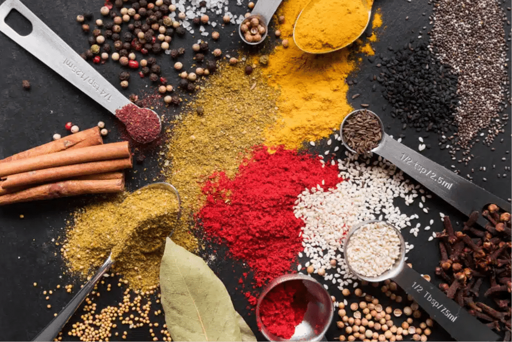 A zenith photograph of different spices on a table.