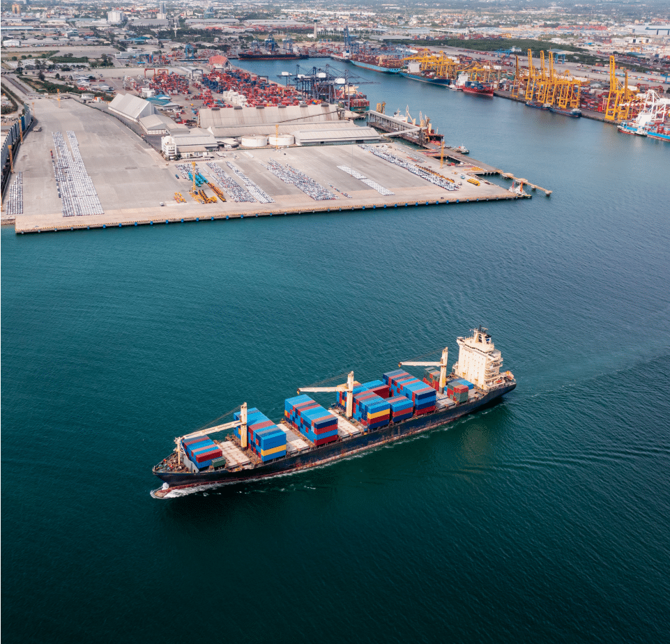 A cargo ship sails through the sea.