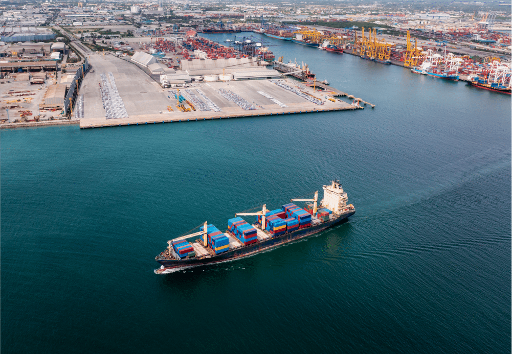 A cargo ship sails through the sea.