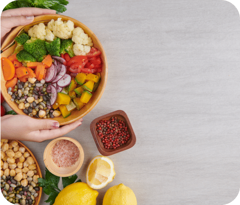A zenith photograph of two hands holding a salad bowl.